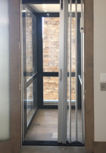 Elvoron Home Elevator in brick building