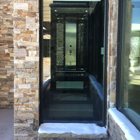 Home Elevator installed in brick building