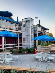 Genesis Enclosure outdoor installation with glass walls on patio